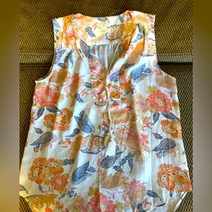 Sleeveless, summery top. Tassel detail. Beautiful colors.